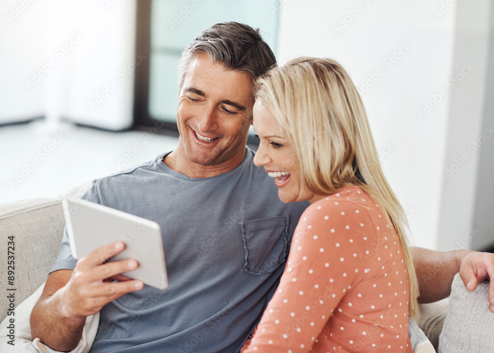 Canvas Prints Mature, couple and happy on tablet on sofa, relaxing and smile for social media in home. Streaming video, digital platform and website on movie subscription, people and weekend break in apartment