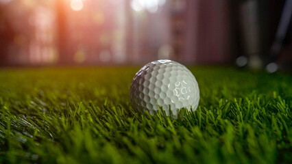 Golf balls on a green lawn in a beautiful golf course with morning sunshine.