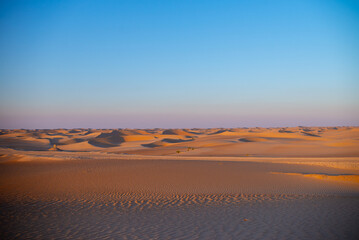 sunset sunrise with beautiful cloud color in the desert sand dune.