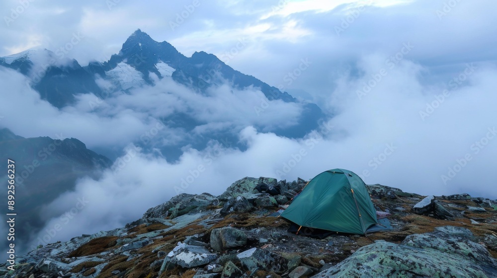 Poster a tent pitched on a mountain ridge with a view of clouds rolling over nearby peaks