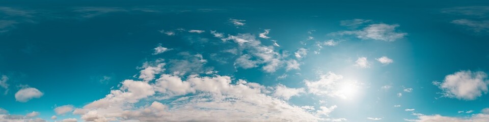 Sky 360 panorama - Bright blue sky filled with fluffy white Cirrus clouds. Seamless hdr spherical 360 panorama. Sky dome sky replacement for aerial drone 360 panoramas. Weather and climate change