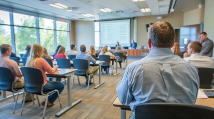 Employees attending a training session in a corporate seminar room.