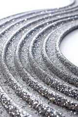 Naklejka premium Spiraling pattern of shiny silver beads in a circular arrangement.