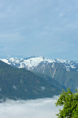 Landscape of valley with fog in the austrian village Bramberg near the mountain Wildkogel