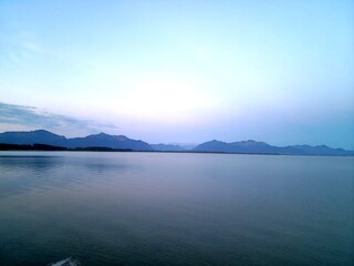Serene Lake with Mountain Range at Dusk

**Keywords:**
serene, lake, mountain range, dus in the mountains