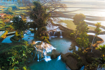 Aerial view of Weekacura Waterfalls at Sunrise, in Sumba, Indonesia