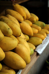 yellow mangoes at the market