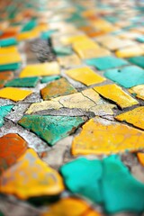 Fototapeta premium The image is a close up of a mosaic tile floor with a variety of colors and textures. The tiles are cracked and broken, giving the floor a worn and weathered appearance. Scene is one of nostalgia