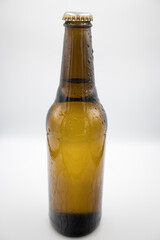 Brown bottle with light beer.
