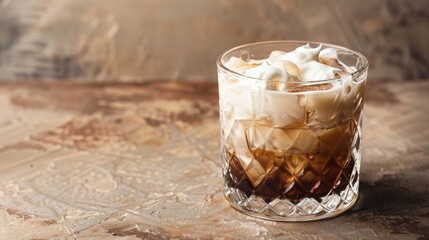 Close-up of a White Russian cocktail in a cut glass tumbler