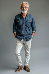 Obraz premium 13. Stylish senior man in a casual outfit, smiling happily, full body, High resolution photography, detailed, realistic, The photo is taken with a Canon EOS R5, with a 17mm, simple solid background,