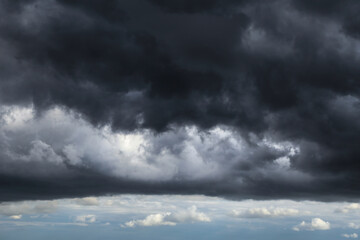 Epic Dramatic Storm sky with dark grey and black cumulus rainy clouds background texture, thunderstorm	