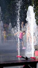 Fototapeta premium Joyful Sprinkler Splash. Splashing into Summer Fun.