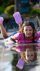 Puddle Perfect : A Little Girl's Pose. Splashing into Summer.