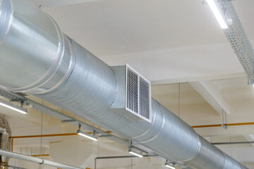 Internal air duct at the enterprise in the workshop with ventilation holes
