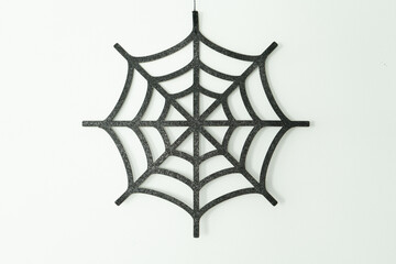 Black web on a white wall, Halloween decoration, autumn time