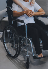 Obraz premium Asian physiotherapist helping elderly woman patient stretching arm during exercise correct with dumbbell in hand during training hand with patient Back problems in garden. Nursing home hospital