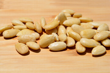 Bamboo board with blanched almonds