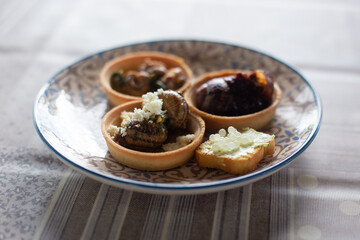 a delicious dish of cooked snails on a plate