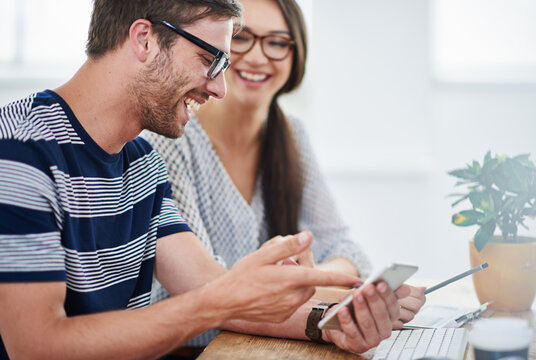 Man, woman or working with smartphone in office for creative, notification for company update on social media. Business people, collaboration and tech or online network with announcement for design