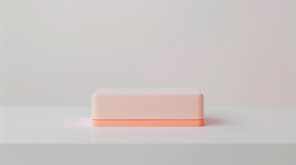 Minimalist rectangular box with soft orange light on a white surface, against a pale background