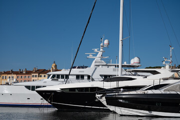Old port of Saint-Tropez famous touristic village on French Riviera, summer vacation with large...