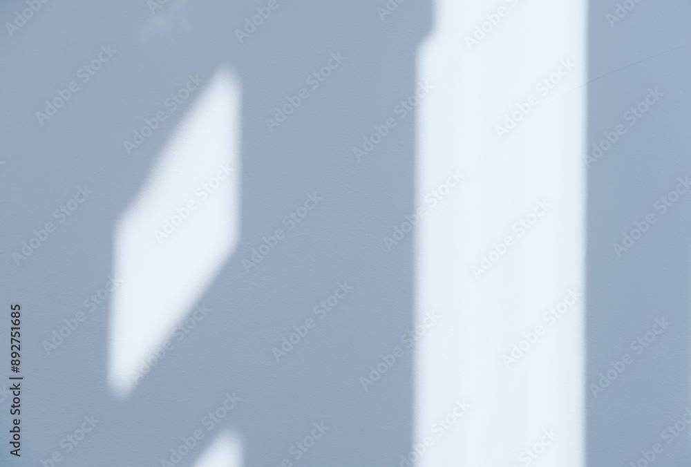 Poster blue background,studio room with bright light, shadow on concrete wall texture for product present,b