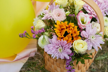 wooden basket with flowers bouquet for birthday.