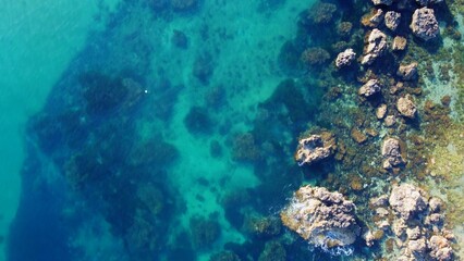 Rocky beach and sapphire sea water on the Maltese island, mediterranean sea, Ghajn Tuffieha bay , Malta. High quality photo