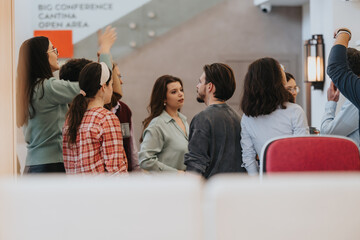 Engaged audience listening back view at a casual business presentation.