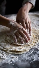Fototapeta premium Baker's Hands Rolling Out Fresh Tortilla Dough on Floured Surface for Homemade Cooking