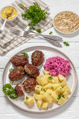 frikadeller, danish meatballs on a plate, top view
