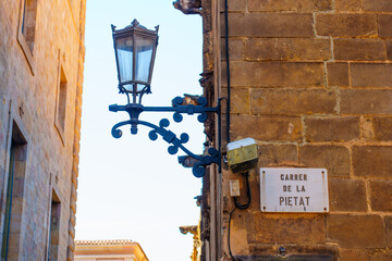 Street Sign And Lantern In Historic Barcelona Neighborhood
