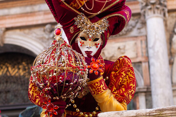 beautiful venetian masks on people during carnival in venice