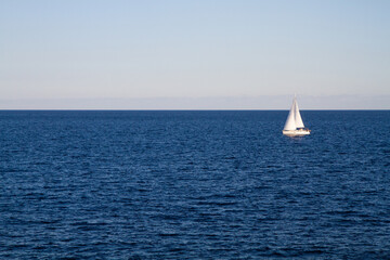 Obraz premium a beautiful ship is sailing in the blue sea