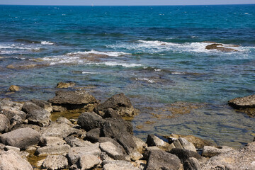 beautiful landscape on the coast of the beach and sea waves against the background of the blue sky