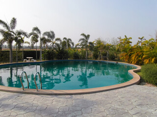 a beautiful large swimming pool near the house