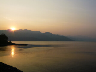 beautiful landscape of mountains on the sea coast at sunset