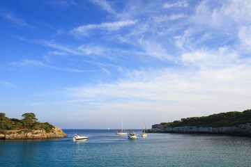 beautiful ships and boats are moored near the shore