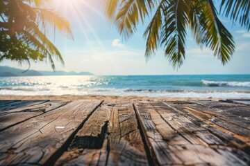 Blur tropical beach with bokeh sun light wave and palm tree on copy space empty old wood table background