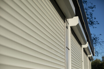Blinds on the windows. Shutters on large windows. Plastic shutters on display case.