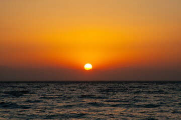 beautiful dramatic landscape of sunset on the sea beach