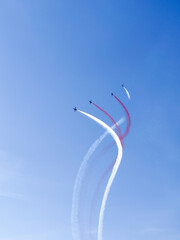 a beautiful air show of fighter jets in the sky over the sea