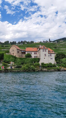 traveling by boat view ns Winery And Castle On A Hill Switzerland
