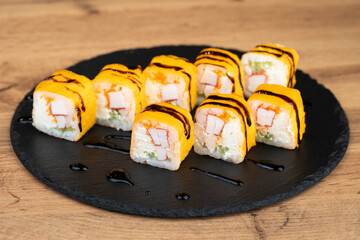 delicious traditional Japanese sushi and rolls on a plate