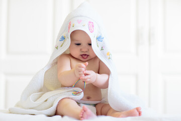 Little baby on white bed