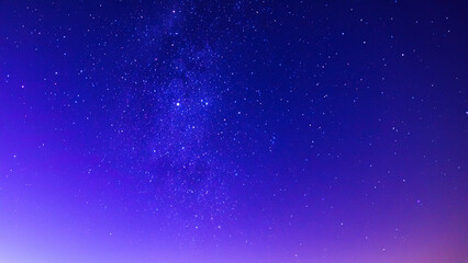Fototapeta premium A blue-purple night sky with shining stars