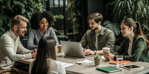 Young professionals gathered around a table, deeply engaged in project collaboration. Each member contributes actively, showcasing professionalism and teamwork.