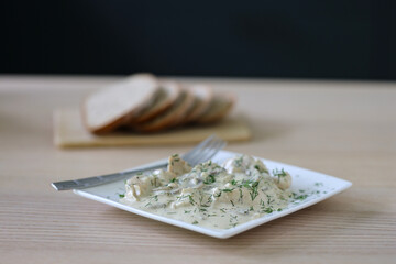 Tender chicken pieces draped in creamy dill sauce
