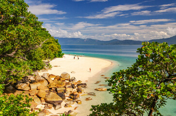 Picturesque tropical beach with boulders and turquoise water on Fitzroy Island. It is a continental...